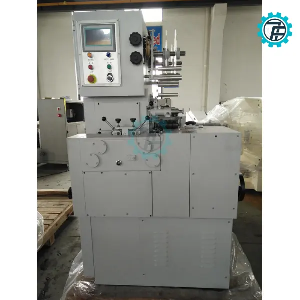 ម៉ាស៊ីនវេចខ្ចប់ស្ករគ្រាប់បង្វិល ២ក្បាល 9 May dong goi keo xoan 2 dau 04